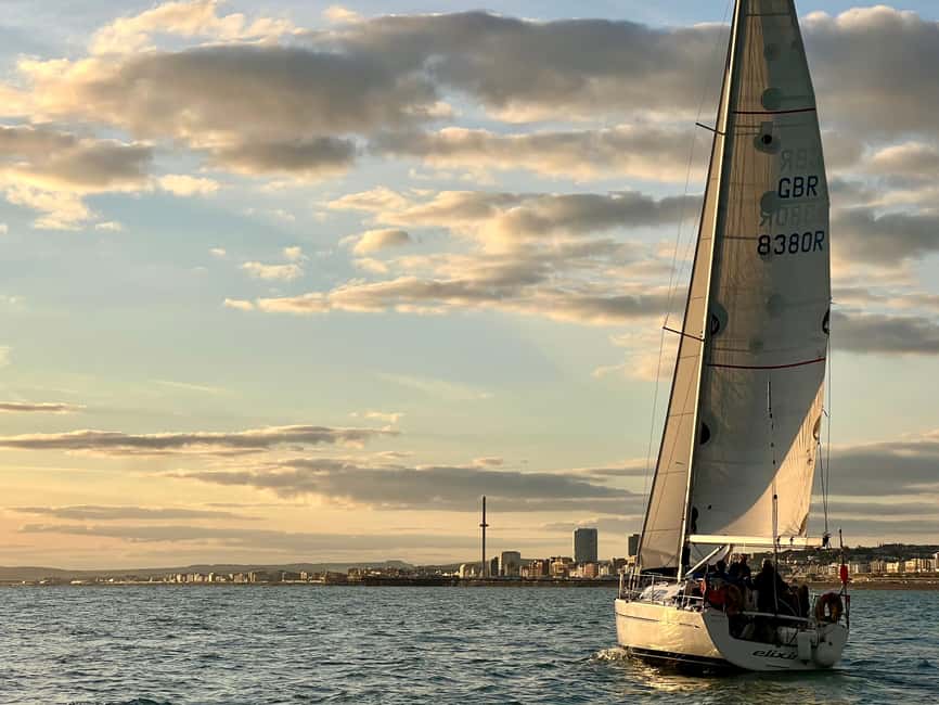 Brighton: Sunset Sailing Cruise with a Glass of Wine - Taking the helm with an instructor, no sailing license required