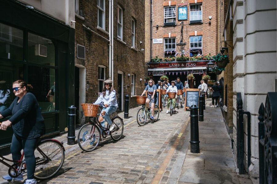 London: Landmarks & Secrets Bike Tour with Pub & Street Art - Covent Garden and the Old Pub Stop: Optional Drinks, Big Social Value