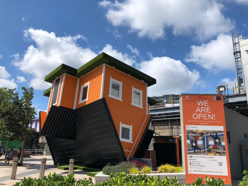 London: Upside Down House Westfield White City Entry Ticket - The warm orange exterior and your first steps into an open-plan illusion