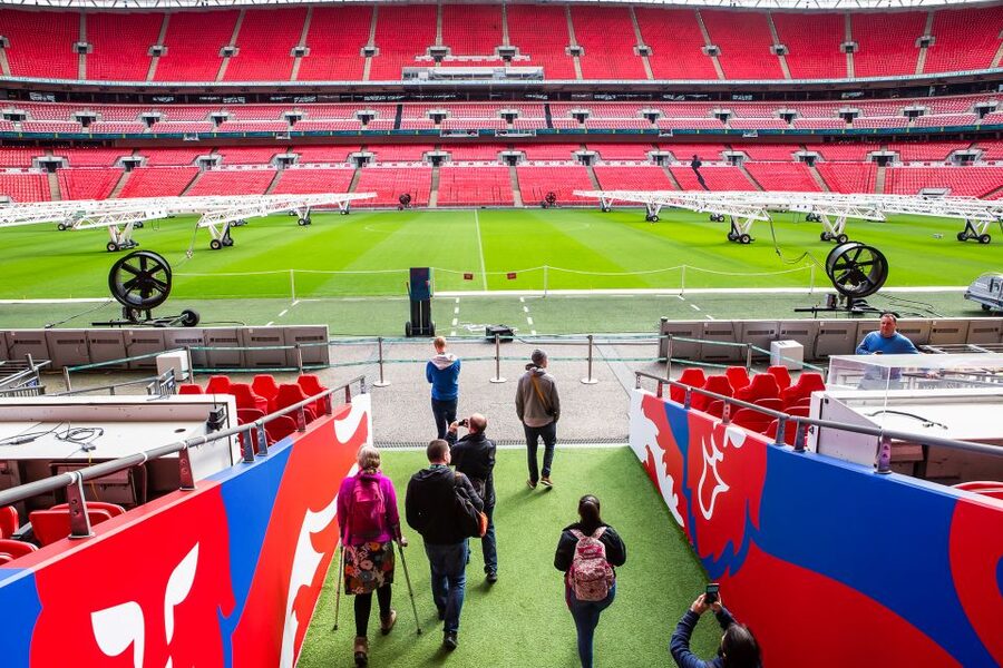 London: Wembley Stadium Guided Tour - Entering Wembley: The Bobby Moore Statue and Level 1 Ticket Desk